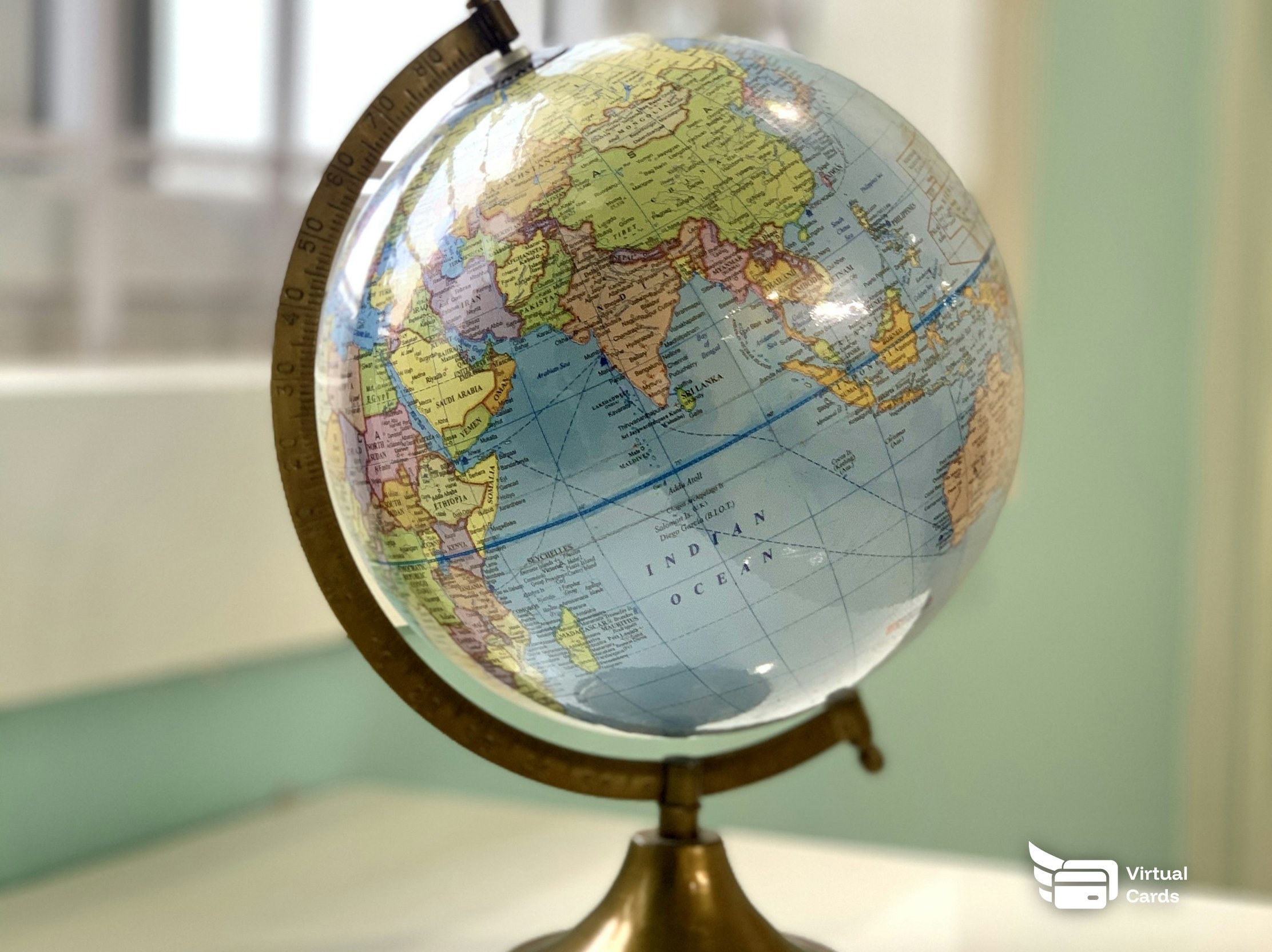 A desk globe on a table, representing international online shopping.