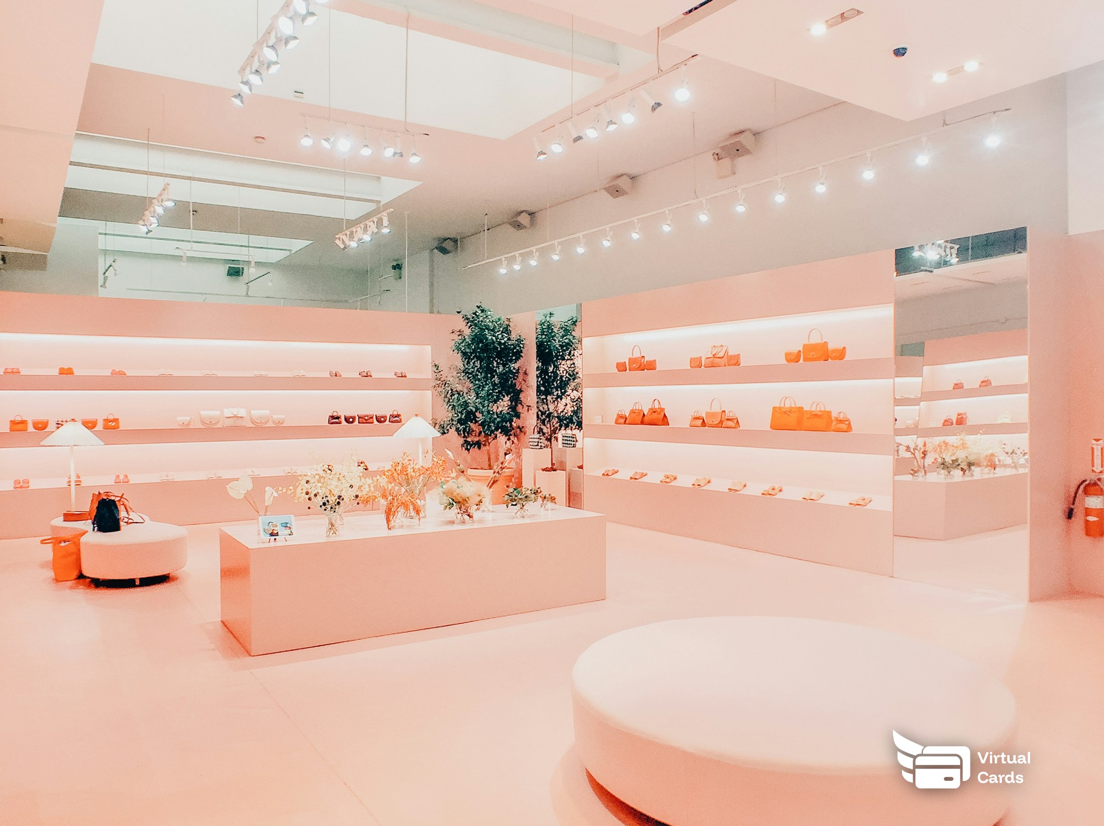 A clean, brightly lit modern retail store interior with display shelves.