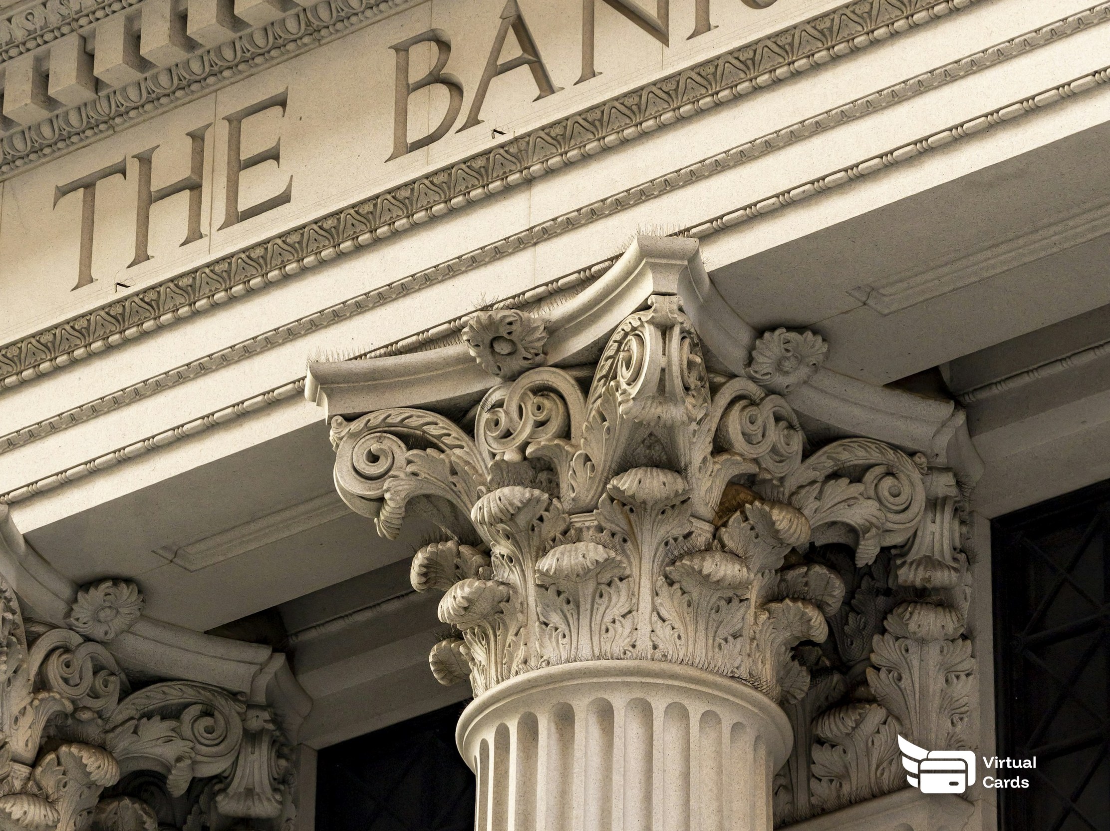 The columned stone facade of a bank building.